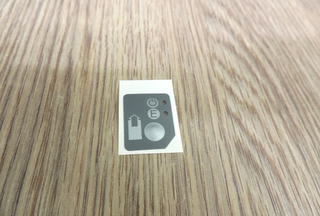 Наклейка на кнопку промотки чековой ленты для кассового аппарата АТОЛ FPrint-22ПТК